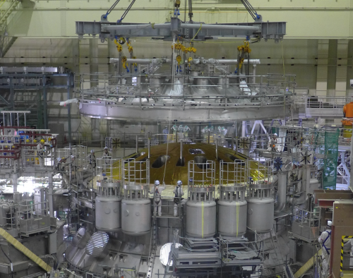 Figure 2 Top lid of cryostat being installed