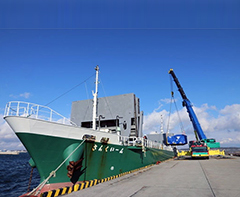 photo of Figure 5. A TFC is being loaded on a transport ship